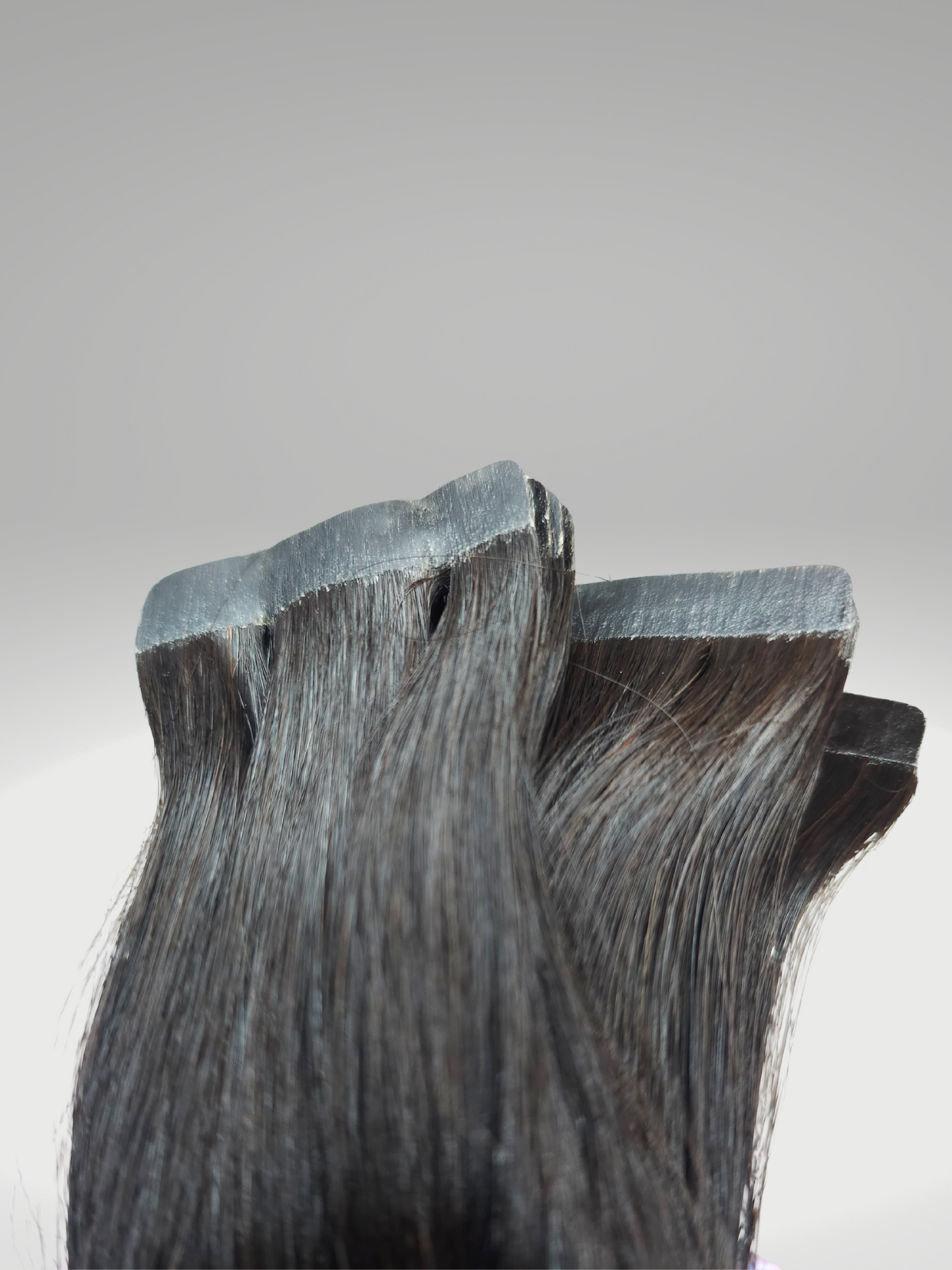 "High-quality Devine Body Wave Tape-in Hair Extensions in various lengths from 16 to 30 inches, showcasing natural wave patterns. Perfect for versatile styling and coloring to match personal fashion preferences.