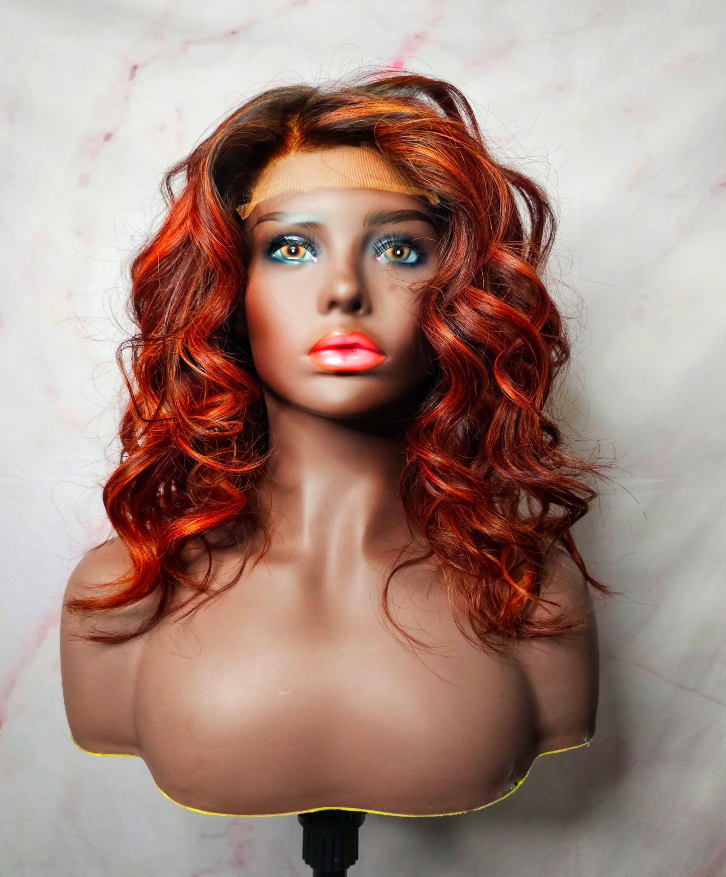 Premium virgin hair body wave wig featuring a transparent lace closure and striking red balayage highlights, offering a seamless and natural look, perfect for versatile styling.
