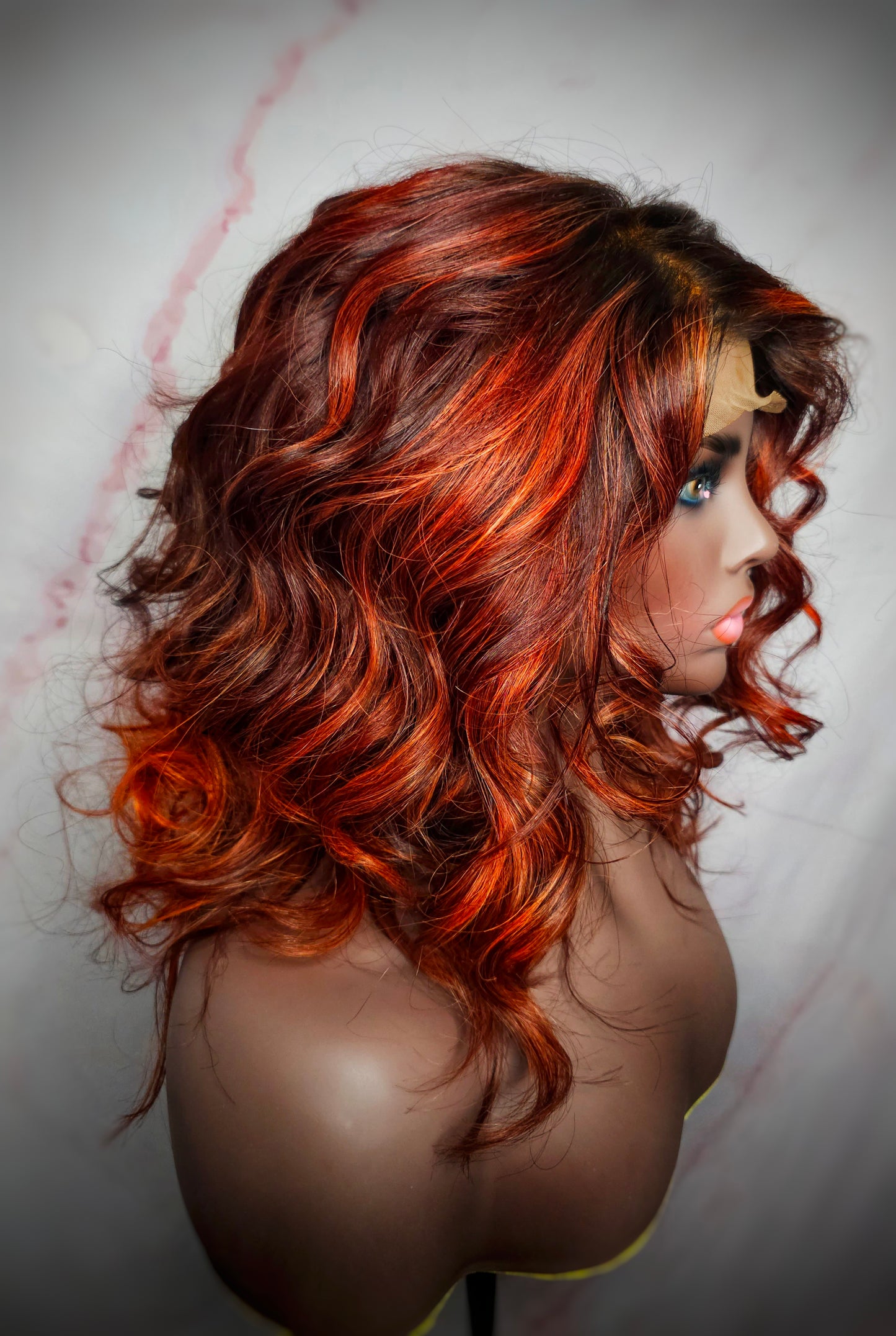 Premium virgin hair body wave wig featuring a transparent lace closure and striking red balayage highlights, offering a seamless and natural look, perfect for versatile styling.